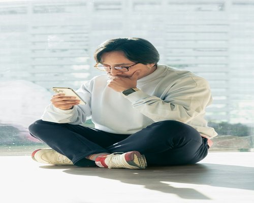 Man sitting calmly and taking a break from smartphone screens