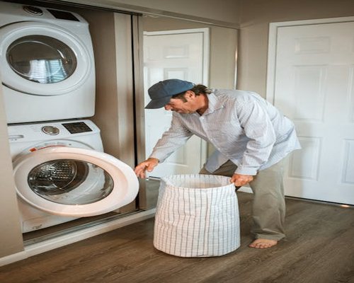 Man preparing his clothes for the next day to save time